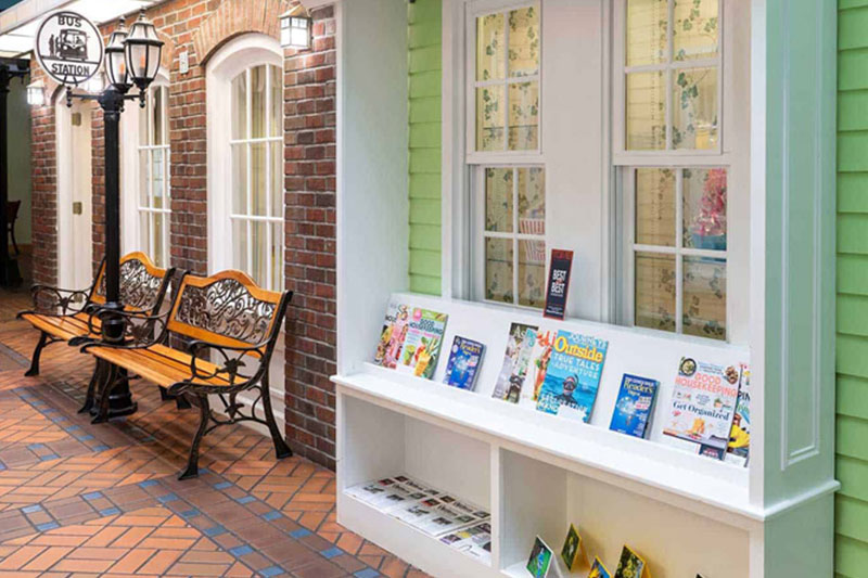 Mock street library with benches and bus stop at Superior Residences of Brandon